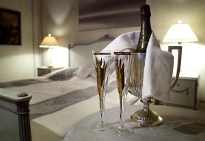 a bottle of champagne is sitting in a basket on a table at Brunnbäcks Herrgård in Mästerbo