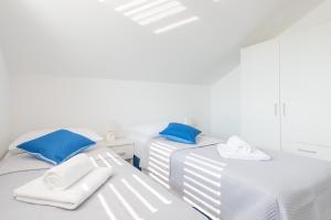 Postel nebo postele na pokoji v ubytování Guesthouse Pezo