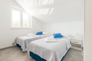 Postel nebo postele na pokoji v ubytování Guesthouse Pezo