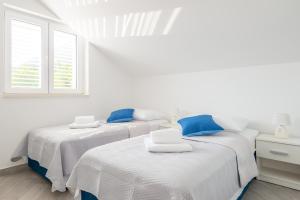 Postel nebo postele na pokoji v ubytování Guesthouse Pezo
