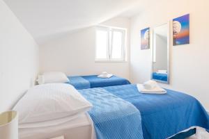 Postel nebo postele na pokoji v ubytování Guesthouse Pezo