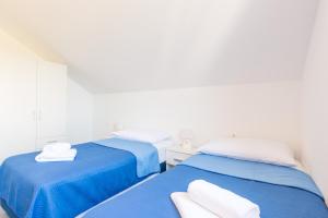 Postel nebo postele na pokoji v ubytování Guesthouse Pezo