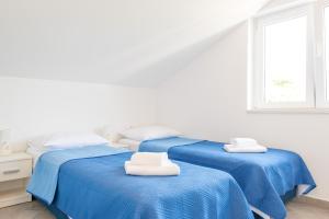 Postel nebo postele na pokoji v ubytování Guesthouse Pezo