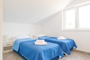 Postel nebo postele na pokoji v ubytování Guesthouse Pezo