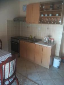 a kitchen with a sink and a stove at Apartments Dijana in Budva