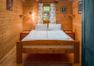 A bed or beds in a room at Haus Panoramablick