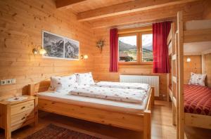 A bed or beds in a room at Haus Panoramablick