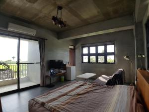 Tempat tidur dalam kamar di Taitung Jia Lulan Tribal