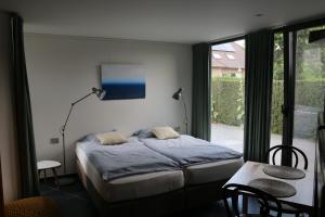 Postel nebo postele na pokoji v ubytování La Chambre d'Amis