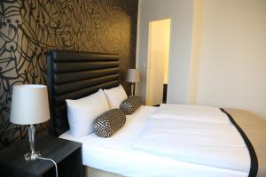 Postel nebo postele na pokoji v ubytování Park Hotel am Berliner Tor