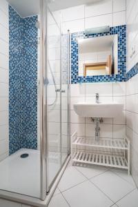 a bathroom with a sink and a shower at S4 Resort Kouty in Loučná nad Desnou +175 photos