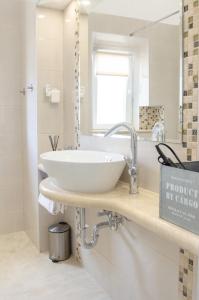 a bathroom with a white sink and a mirror at Kanavelic place - Old town Korcula in Korčula +47 photos