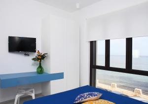 TV a/nebo společenská místnost v ubytování Sea Windows Suite