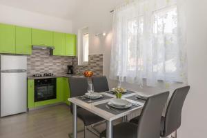 Kuchyňa alebo kuchynka v ubytovaní Apartments Gracia