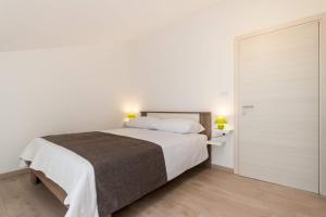 Posteľ alebo postele v izbe v ubytovaní Apartments Gracia
