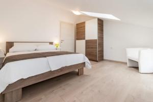 Posteľ alebo postele v izbe v ubytovaní Apartments Gracia