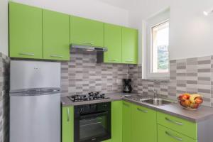 Kuchyňa alebo kuchynka v ubytovaní Apartments Gracia