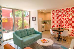 a living room with a couch and a table at Modern Casita in Historic Downtown Albuquerque in Albuquerque