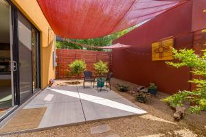 a patio with a table and chairs on it at Modern Casita in Historic Downtown Albuquerque in Albuquerque