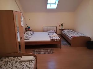 Postel nebo postele na pokoji v ubytování Hostel Poslon