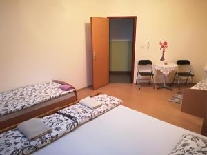 Postel nebo postele na pokoji v ubytování Hostel Poslon