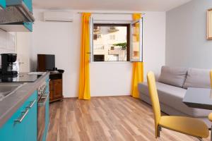 Kuchyňa alebo kuchynka v ubytovaní Cakic apartmani