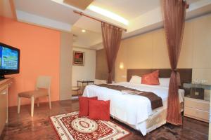 Cama o camas de una habitación en Ying Xiang Wen Quan Hotel