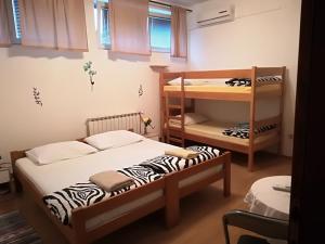 Posteľ alebo postele v izbe v ubytovaní Hostel Poslon