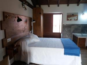 Posteľ alebo postele v izbe v ubytovaní Apartamento del Abuelo