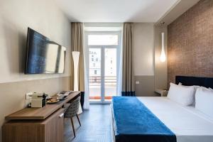 Postel nebo postele na pokoji v ubytování A World Aparts - Barberini Boutique Hotel