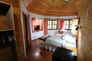 Cama ou camas em um quarto em Santa Maria Pucon