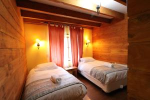 Cama ou camas em um quarto em Santa Maria Pucon