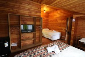 Cama ou camas em um quarto em Santa Maria Pucon