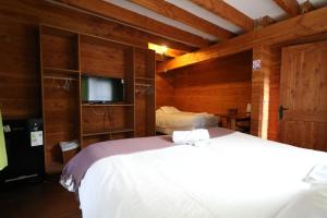 Cama ou camas em um quarto em Santa Maria Pucon