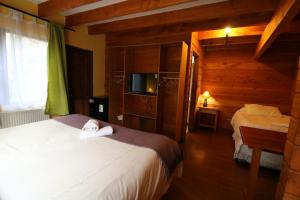 Cama ou camas em um quarto em Santa Maria Pucon