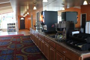 a kitchen with a counter with a coffee maker on it at Americas Best Value Inn Geneva in Geneva