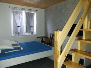 Posteľ alebo postele v izbe v ubytovaní olszanka