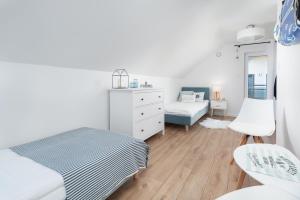 Postel nebo postele na pokoji v ubytování ApartDomek7b Jasne Wybrzeże - nowy i luksusowy
