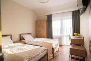 Łóżko lub łóżka w pokoju w obiekcie Dom Wypoczynkowy Simurg