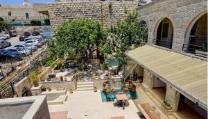 an overhead view of a courtyard in a building at Dar Sitti Aziza in Bethlehem