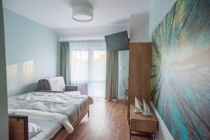 Łóżko lub łóżka w pokoju w obiekcie Dom Wypoczynkowy Simurg