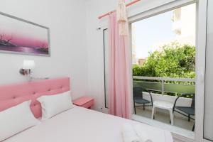 A bed or beds in a room at Kallithea Studios