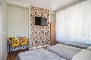 Telewizja i/lub zestaw kina domowego w obiekcie Dom Wypoczynkowy Simurg