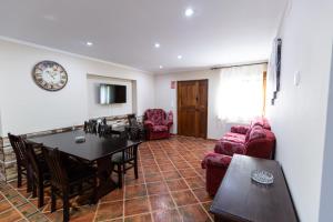 a living room with a table and a dining room at casa La Trillera in Tornín