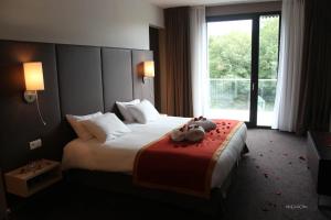 Krevet ili kreveti u jedinici u okviru objekta Hotel de la Source