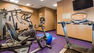 a gym with two exercise bikes and a treadmill at Best Western Plus Carousel Inn & Suites Burlington in Burlington