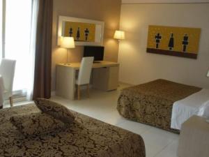 A bed or beds in a room at Mediterraneo Palace Hotel