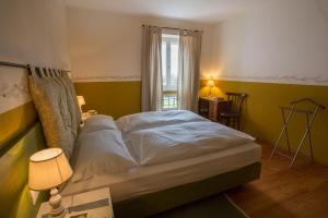 Postel nebo postele na pokoji v ubytování La Collina delle Mignole