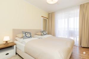 Posteľ alebo postele v izbe v ubytovaní Jantar Apartamenty Exclusive Polanki Park SPA
