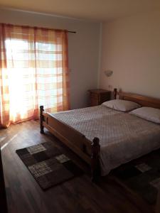Ένα ή περισσότερα κρεβάτια σε δωμάτιο στο Apartment and Rooms Hacienda Stelio